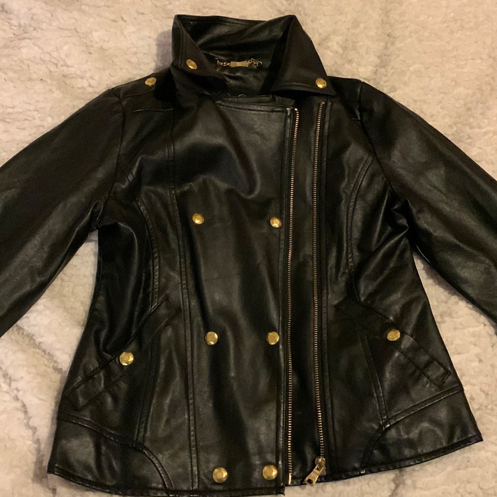 This a a nicely made leather jacket, warm. It has pink lining in the inside.